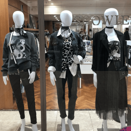 Image of front of shop with 3 mannequins with latest arrivals