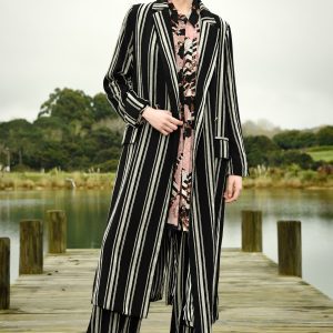 The Long Night Coat has a double-breasted closure and flap pockets you’ll have a timeless piece that will elevate any winter look.