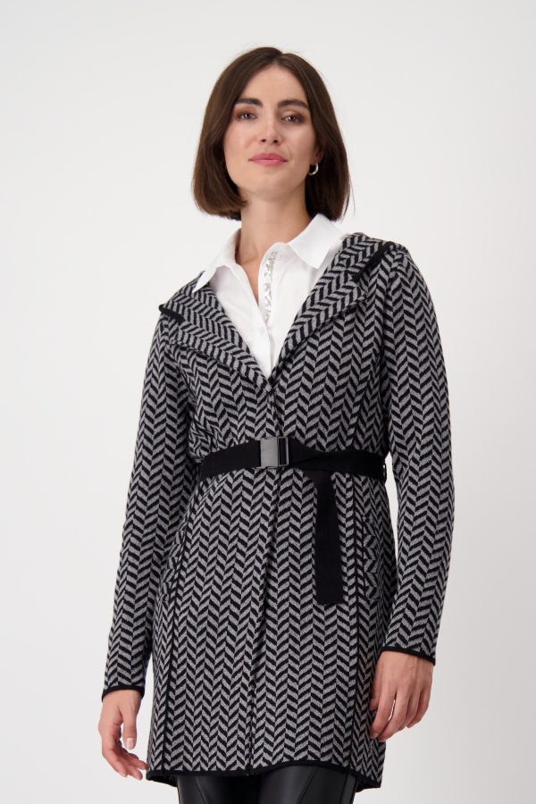 An Italian-designed herringbone belted longline coatigan is a stylish and sophisticated outerwear piece combining the elegance of a coat with the comfort of a cardigan.