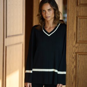 This Attic Knit Top in a relaxed-fit is made for comfort and style, it has a v-shaped neckline, contrast tipping and a hip-length design.