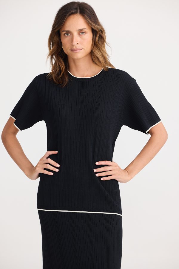 Shop the Attic Tee featuring a round-shaped neckline with a contrast tipping neckband, cuffs and hem, short sleeves, and a relaxed fit.