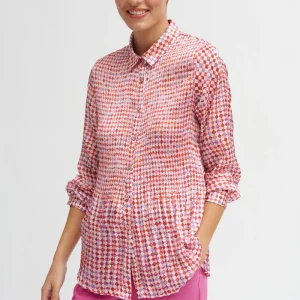 This Pleated Flowing Dana Blouse is a beautifully designed piece that combines elegance with a bit of artistic flair, making it a statement outfit piece.