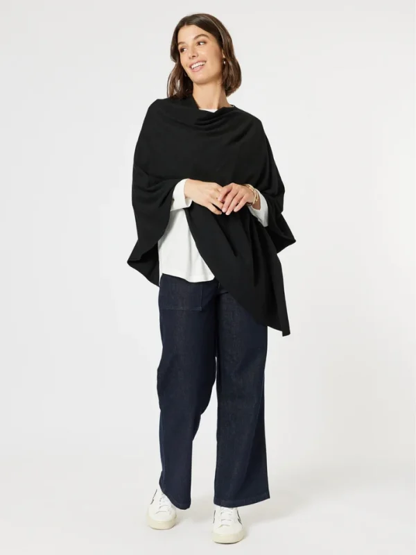 Wrap yourself in elegance with the Macy Knit Poncho. Features a draped neckline and asymmetric hem, this versatile piece adds a stylish layer to any outfit.
