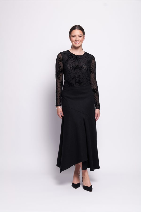 This stylish International Velvet Top by Foil has a mesh crew neck and long sleeves. It's the perfect winter piece for layering under any jacket.