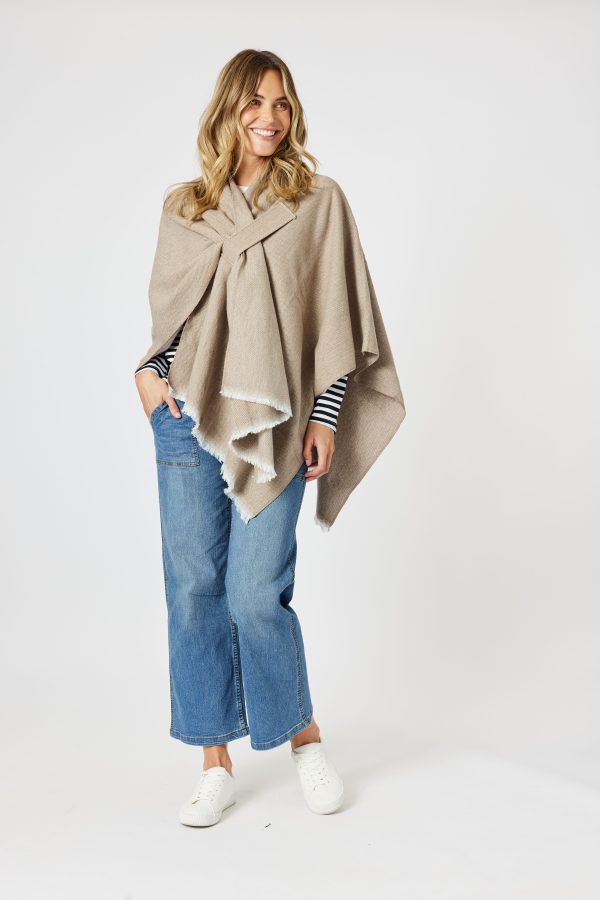 This piece boasts an edge-to-edge front design, complete with a self-tab to keep the wrap securely in place, ensuring both comfort and warmth.