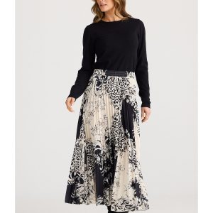 The Alias Pleated Skirt blends contemporary elegance with classic appeal. Its permanently pleated design flows beautifully with every movement.